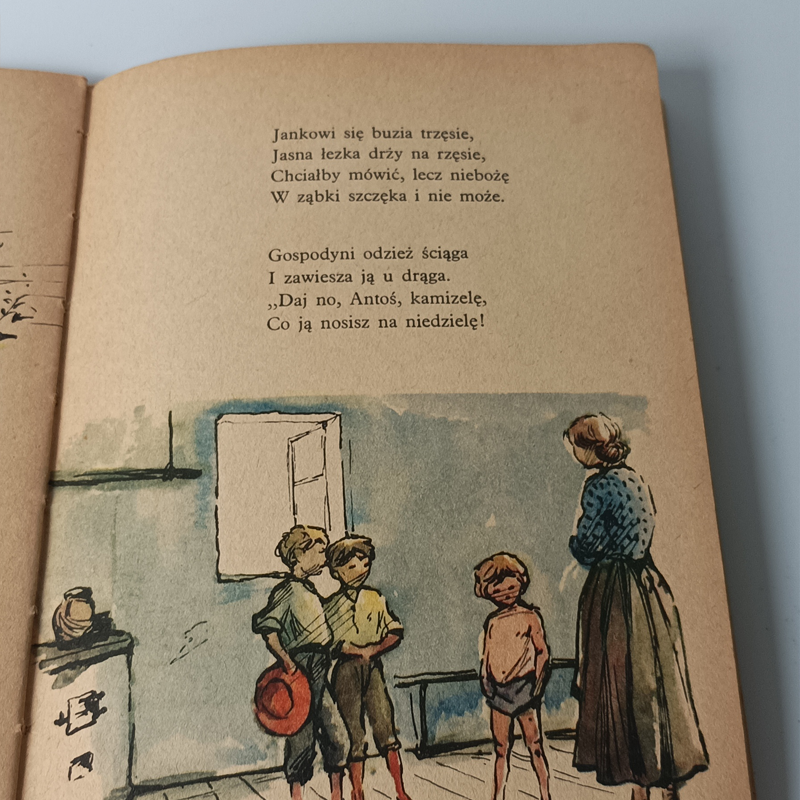 Książka „O Janku Wędrowniczku” Maria Konopnicka – Nasza Księgarnia 1958 (Vintage) Wnętrze książki z wierszem Marii Konopnickiej oraz barwną ilustracją przedstawiającą wiejską izbę, gospodynię i dzieci.